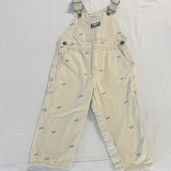 OshKosh B'gosh Kids Tan Overalls w/ embroidered paper airplane design - Picture 1 of 5